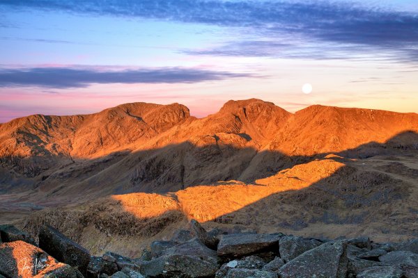 Scafell at sunrise as the moon sets behind Scafell Pike. Days like this don't come along so often and I was really pleased to be able to capture this stunning image from the summit of Bowfell. Canon EOS 5d Mk11; Canon EF 24-105 L IS USM Lens. Click on the picture to expand and explore....